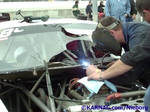 Broken Winshield caused by flying lead on the track at USA International Speedway